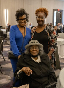 An award winner poses with her family during OHCA's 2023 Excellence Awards