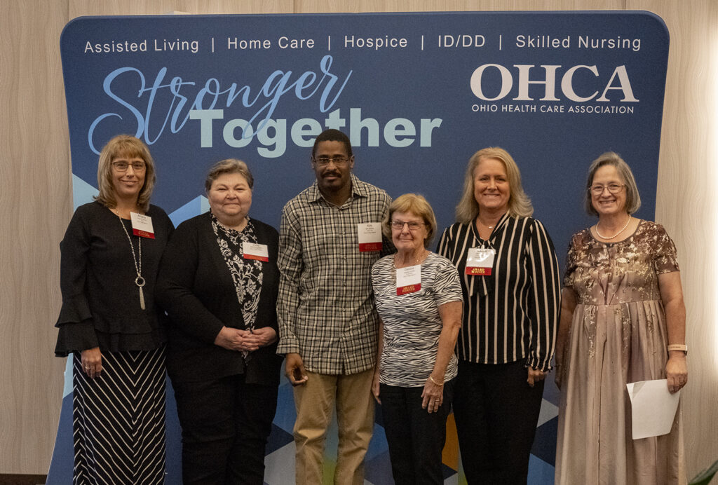 Award winners pose on the stage during OHCA's 2023 Excellence Awards