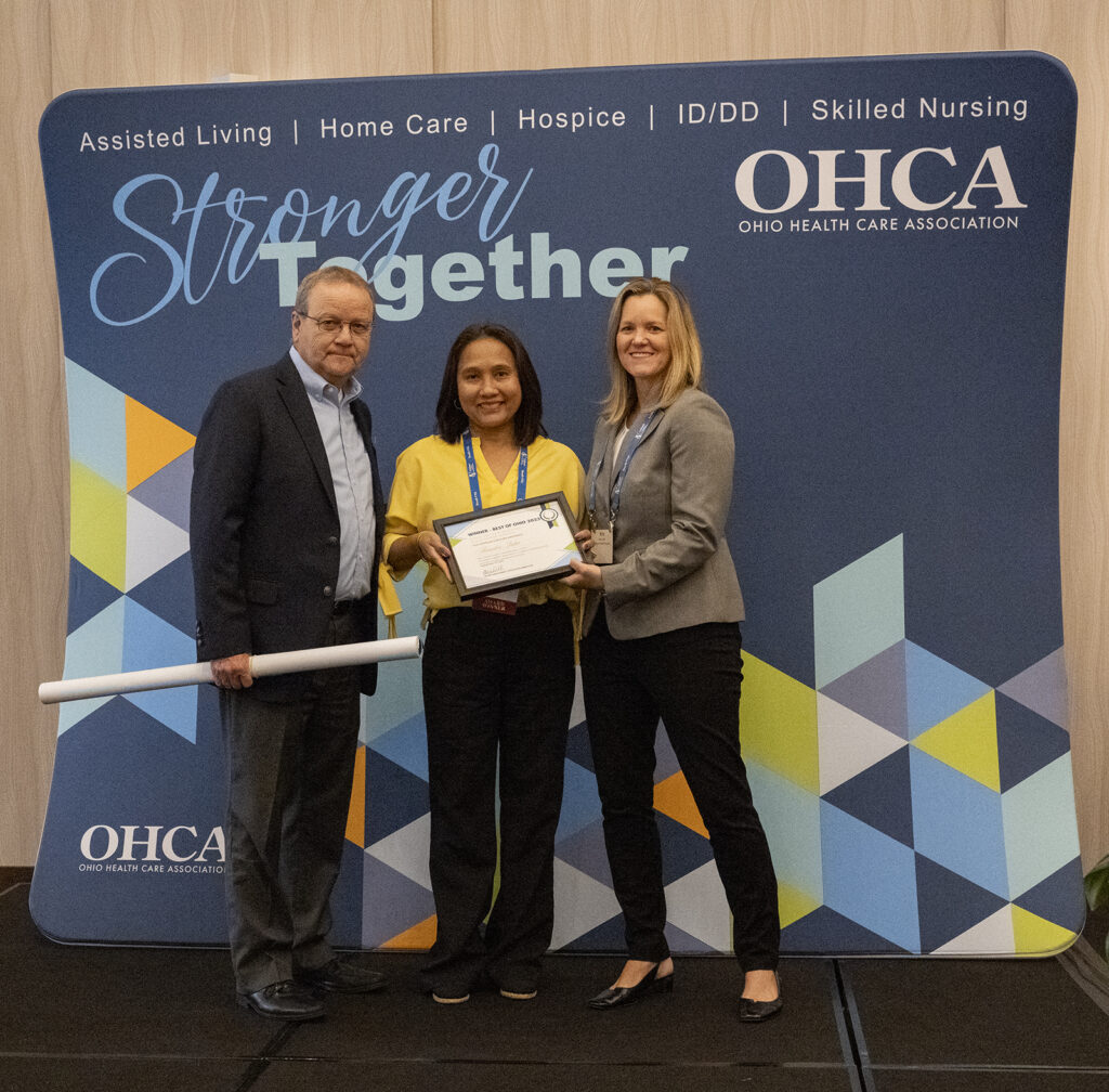 An award winner is presented with her certificate during OHCA's 2023 Excellence Awards