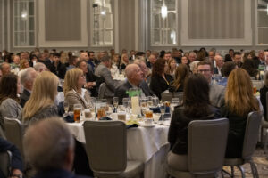 Attendees listen to speakers during the event photography coverage for the Conway Family Business Awards 2023