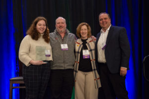 A team poses on stage during the event photography coverage for the Conway Family Business Awards 2023