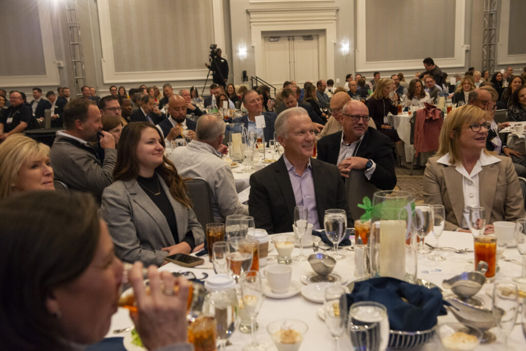 Attendees listen to speakers during the event photography coverage for the Conway Family Business Awards 2023