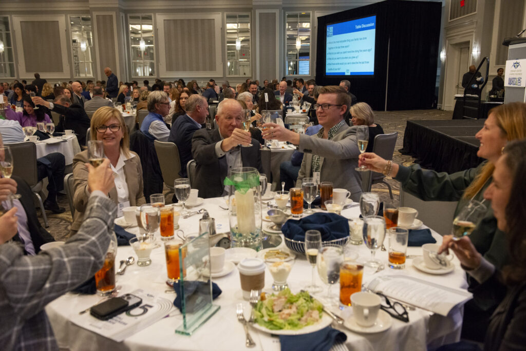 Attendees toast to celebrating during the event photography coverage for the Conway Family Business Awards 2023