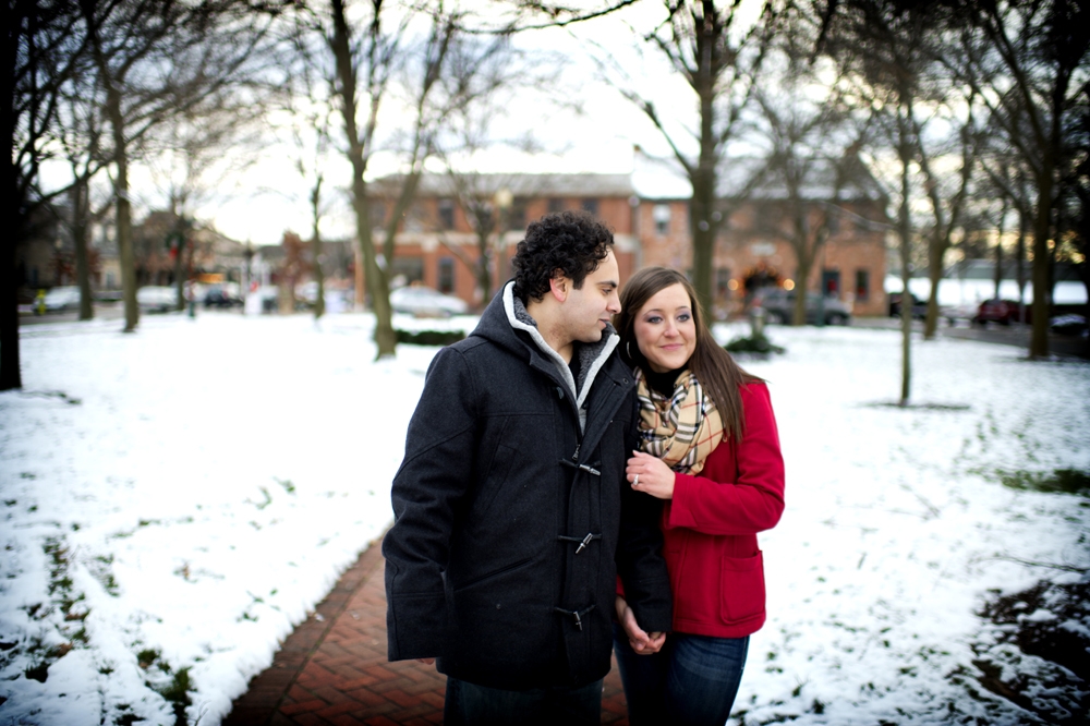 Engagement Photography - Winter couple walking down snowy brick path
