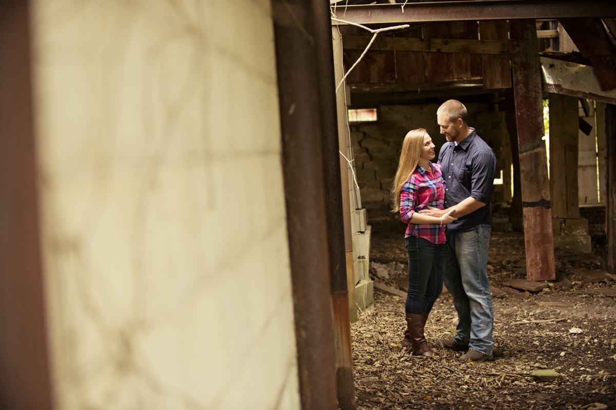 Engagement Photography - Couple hugging in Autumn barn