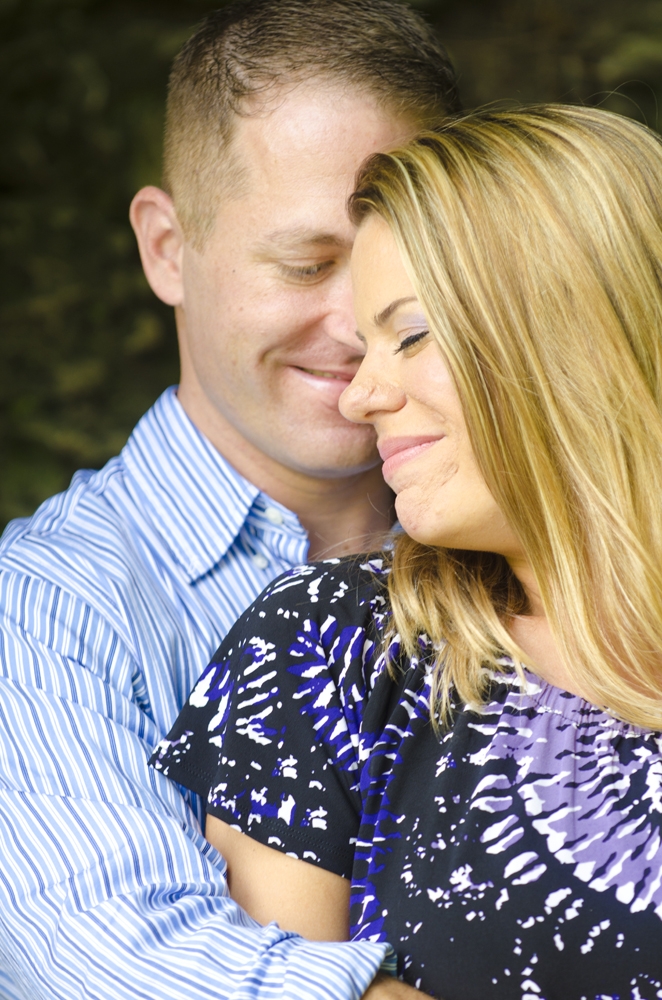 Engagement Photography - Outdoor couple embracing and smiling