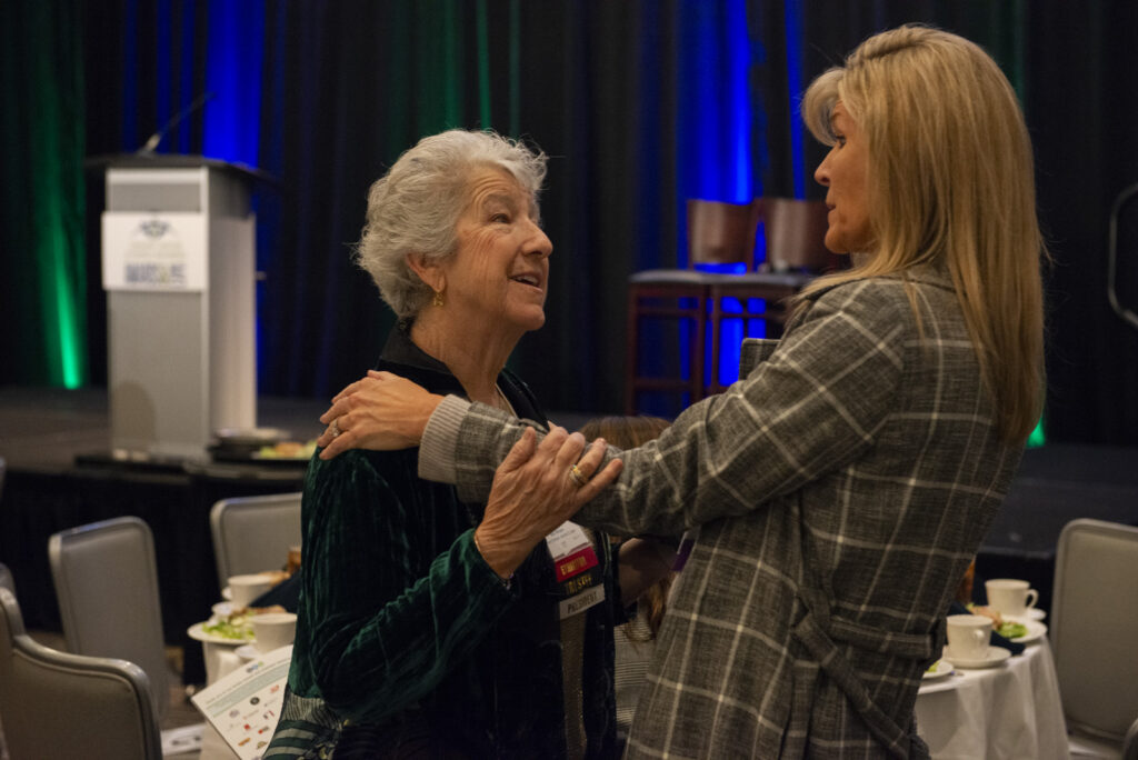Business women greet each other during the event photography coverage for the Conway Family Business Awards 2023